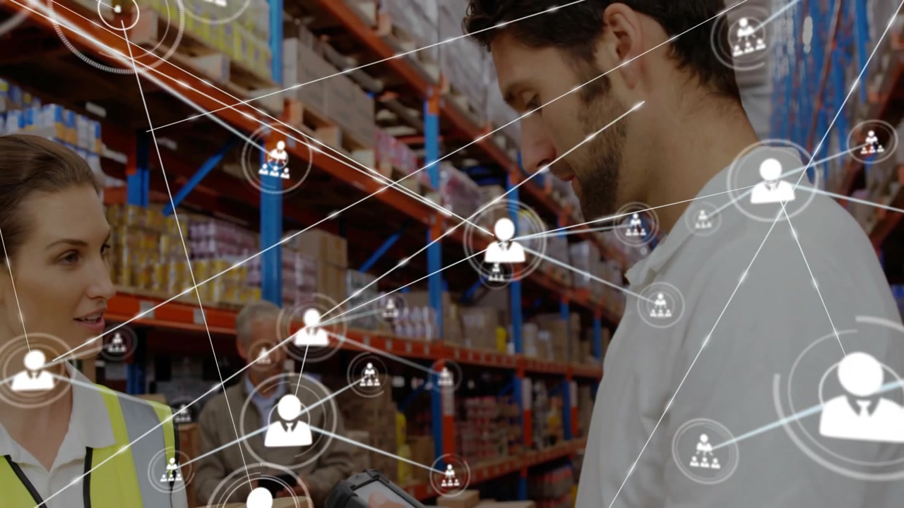 supply chain team reviewing tablet data in warehouse racks, showing floating network icons