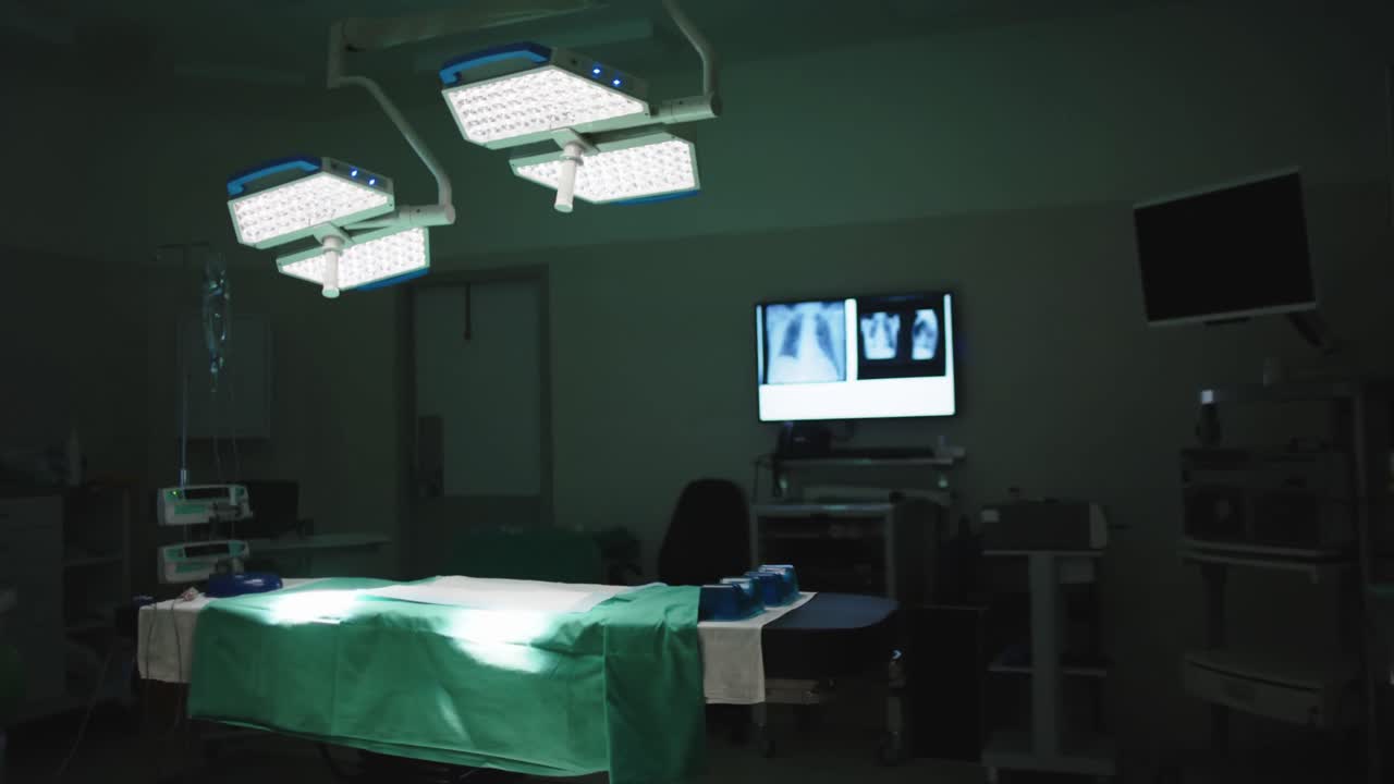 General view of empty operating room with bed and xrays in slow motion