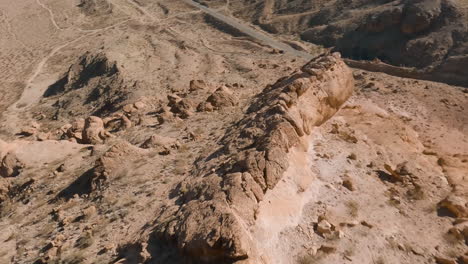 fpv drone flying over rugged desert canyons and hills