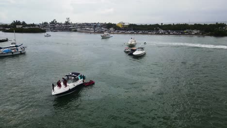 Tourists-on-Spring-Break-Enjoying-Miami,-Florida-Ocean-on-Boats-and-Yachts---Aerial