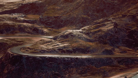 empty winding road through the valleys and hills