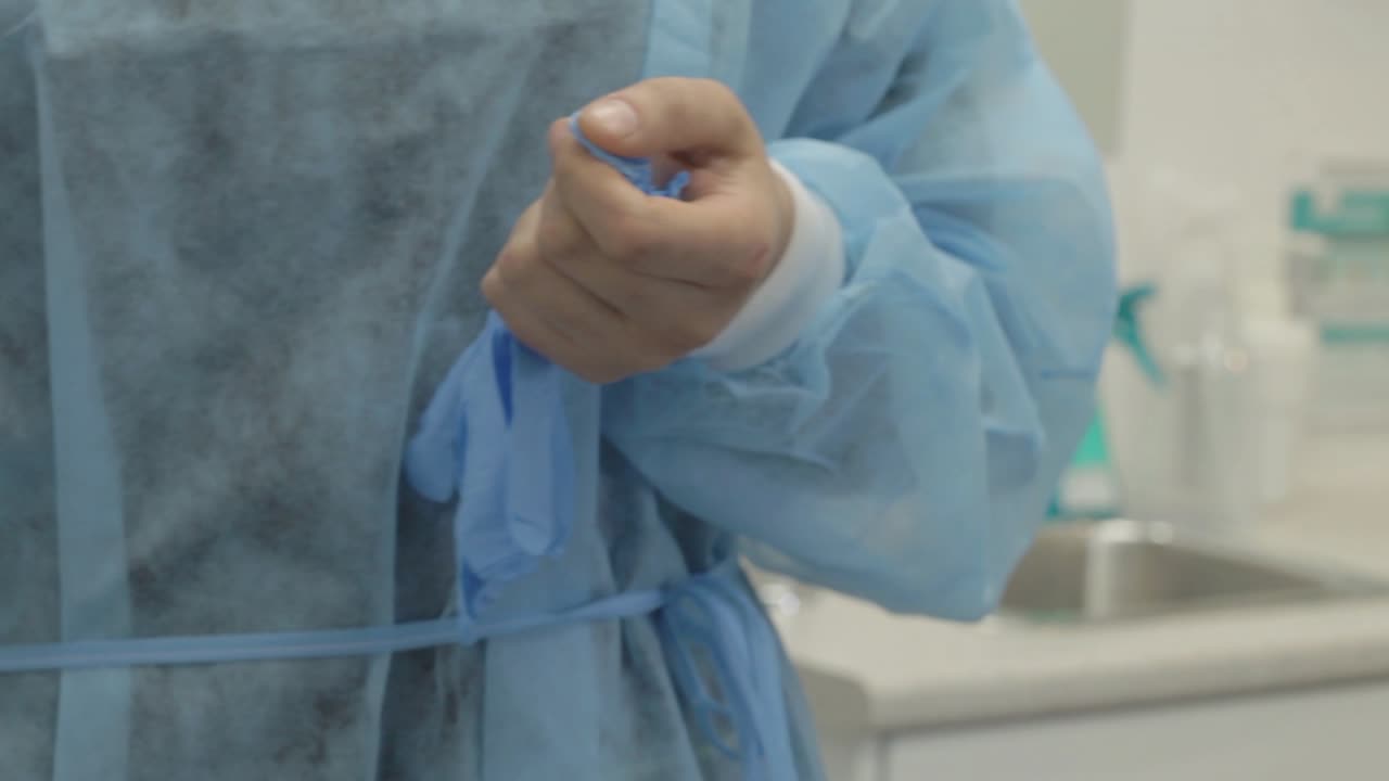 Putting on latex gloves