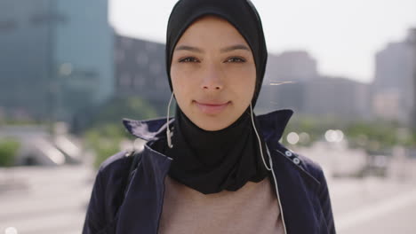 slow motion portrait of beautiful mixed race muslim woman looking serious pensive at camera in sunny urban city wearing headscarf