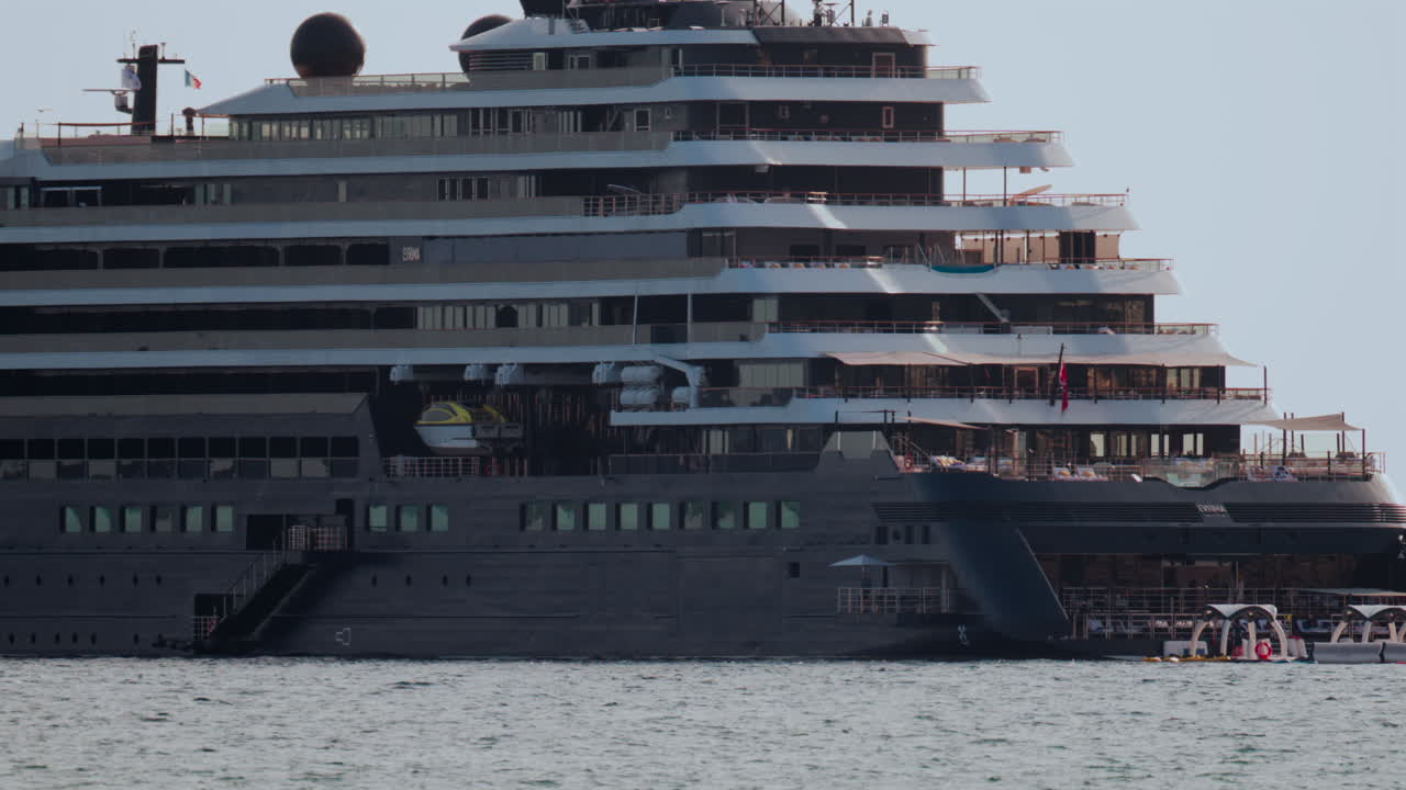 Cannes, France - October 4, 2025: Massive luxury cruise ship sailing on calm sea under pale sky