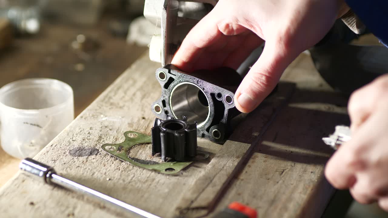 Removing old water pump impeller from housing outboard servicing