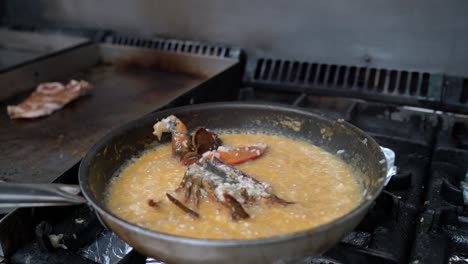 pans of appetizing dishes preparing on stove in kitchen