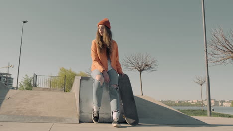 Skater-Girl-Waiting-For-Someone-Sitting-On-A-Skate-Park-2