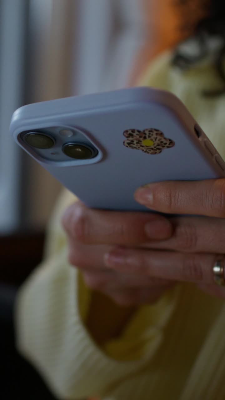Woman using a purple smartphone