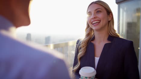 multi ethnic business colleagues coffee break on rooftop