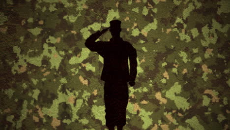 silhouette of soldier saluting against camouflage background