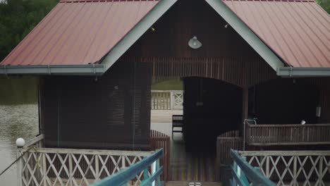 Person-walking-inside-the-river-house-in-Malaysia