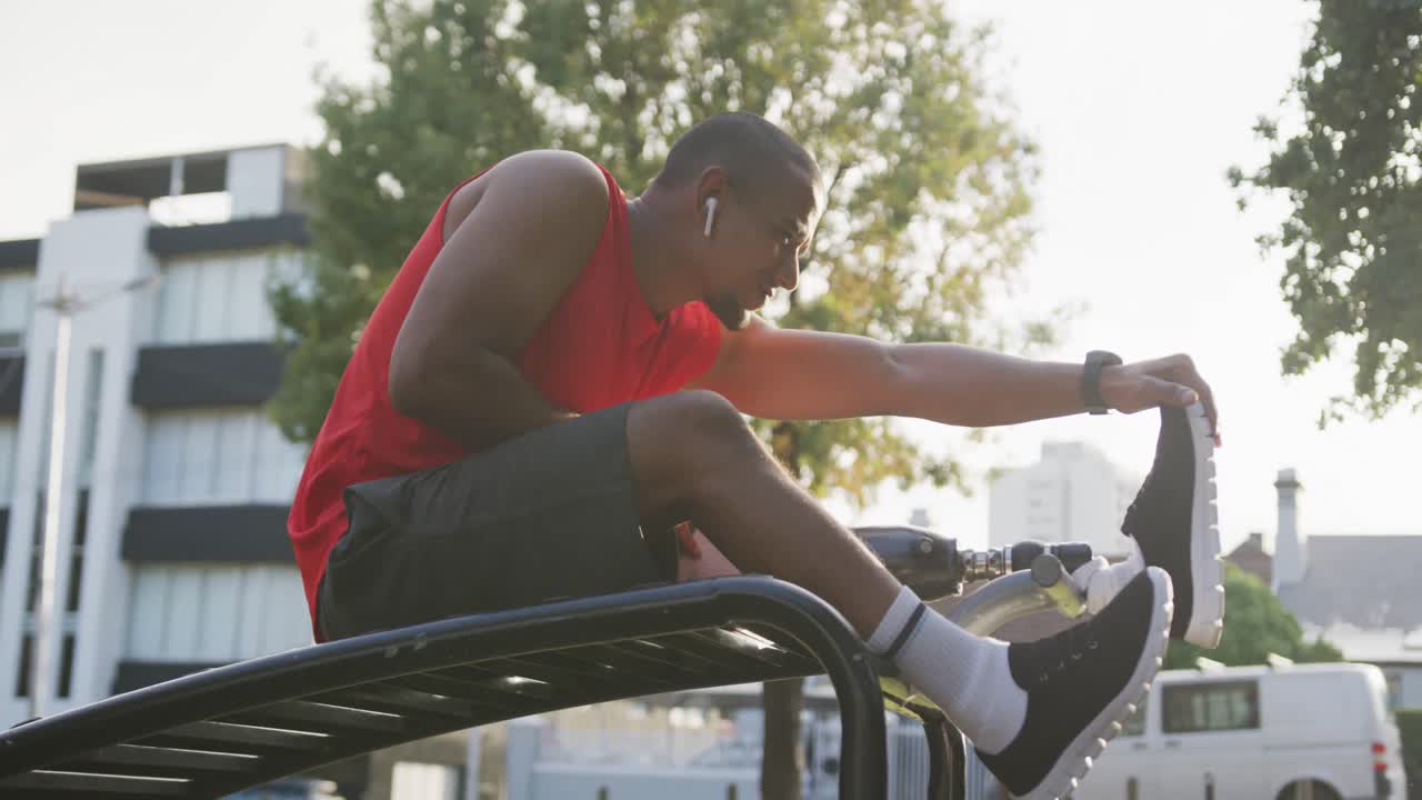 Side view man with prosthetic leg stretching