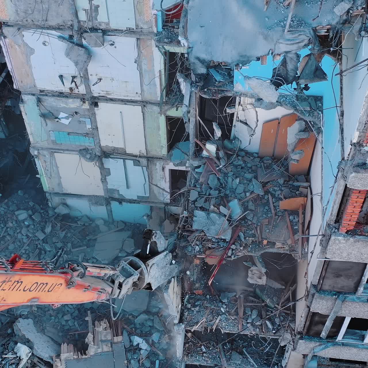 Destroying old building. Destroying large old house with special machine