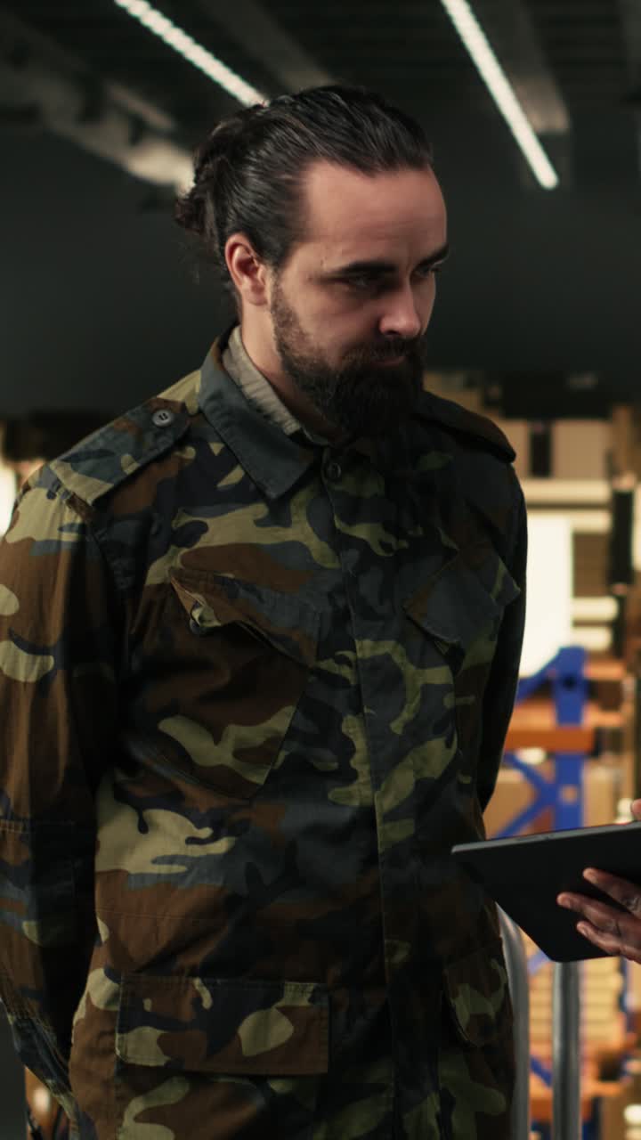 Vertical Video Army logistics team in uniform working in warehouse on military base