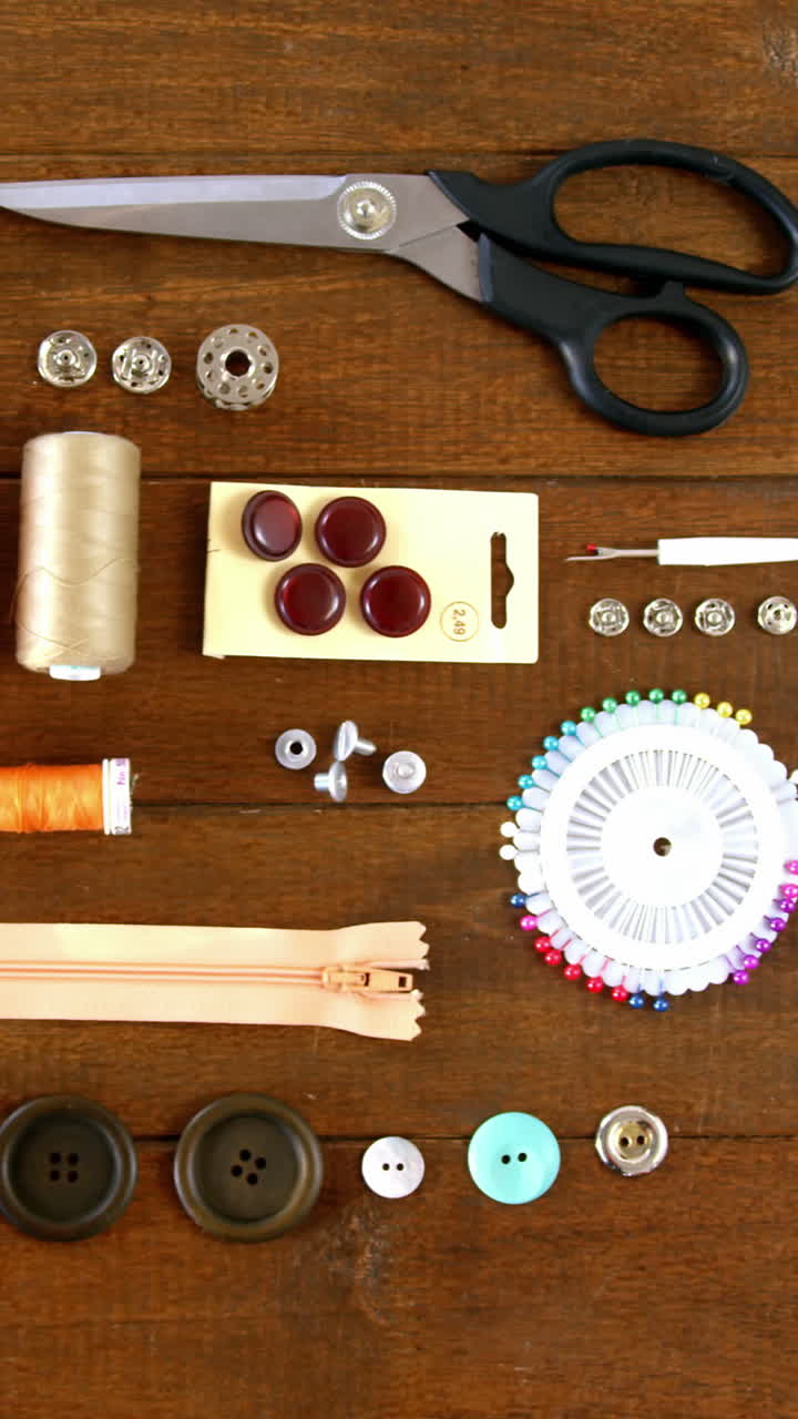 Close-up of set of threads and sewing tools