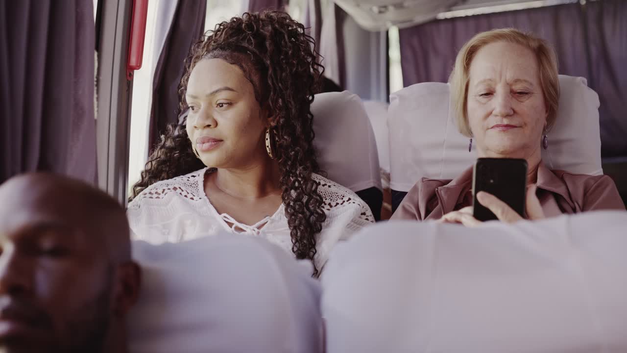 Diverse passengers traveling on a bus or train