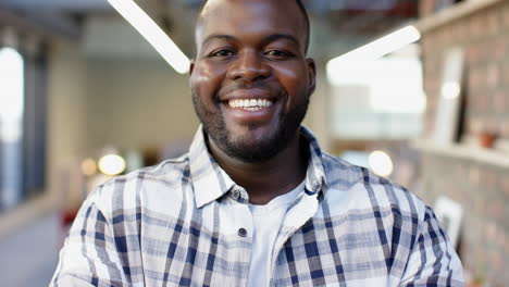 african american male colleague smiling in casual office setting