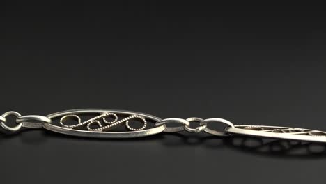 close-up of a silver filigree bracelet