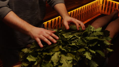 traditional russian bath treatment with oak leaves
