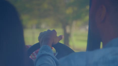 young couple on a road trip in their pick-up truck