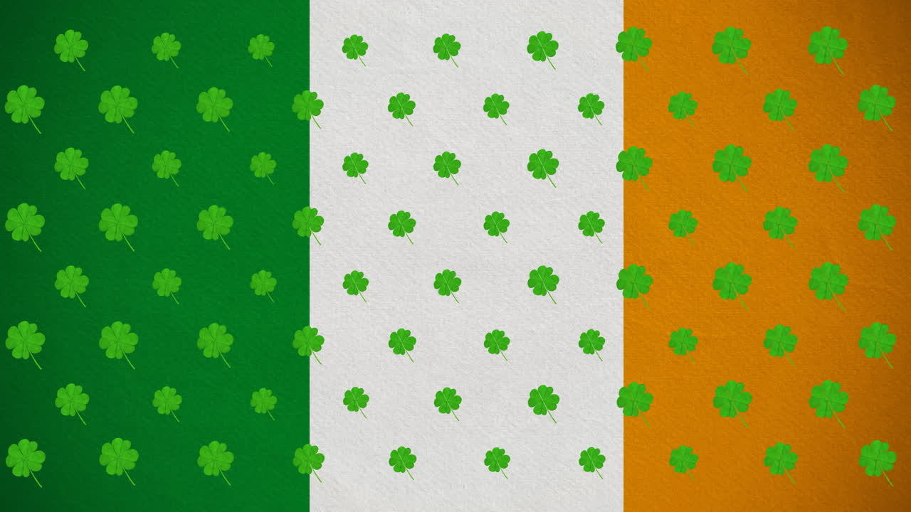 Animazione digitale di molteplici foglie di trifoglio che si muovono contro la bandiera irlandese.