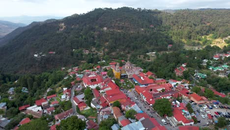 orbital drone shot of mineral del chico main avenue town in hidalgo mexico during sunset