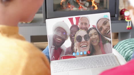 happy diverse friends having christmas laptop video call, slow motion
