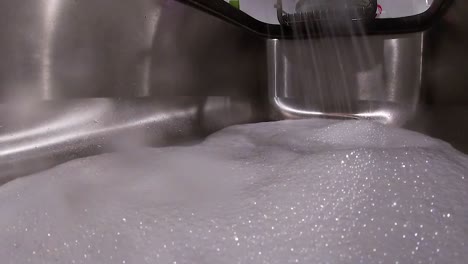 water foaming in sink for dishes