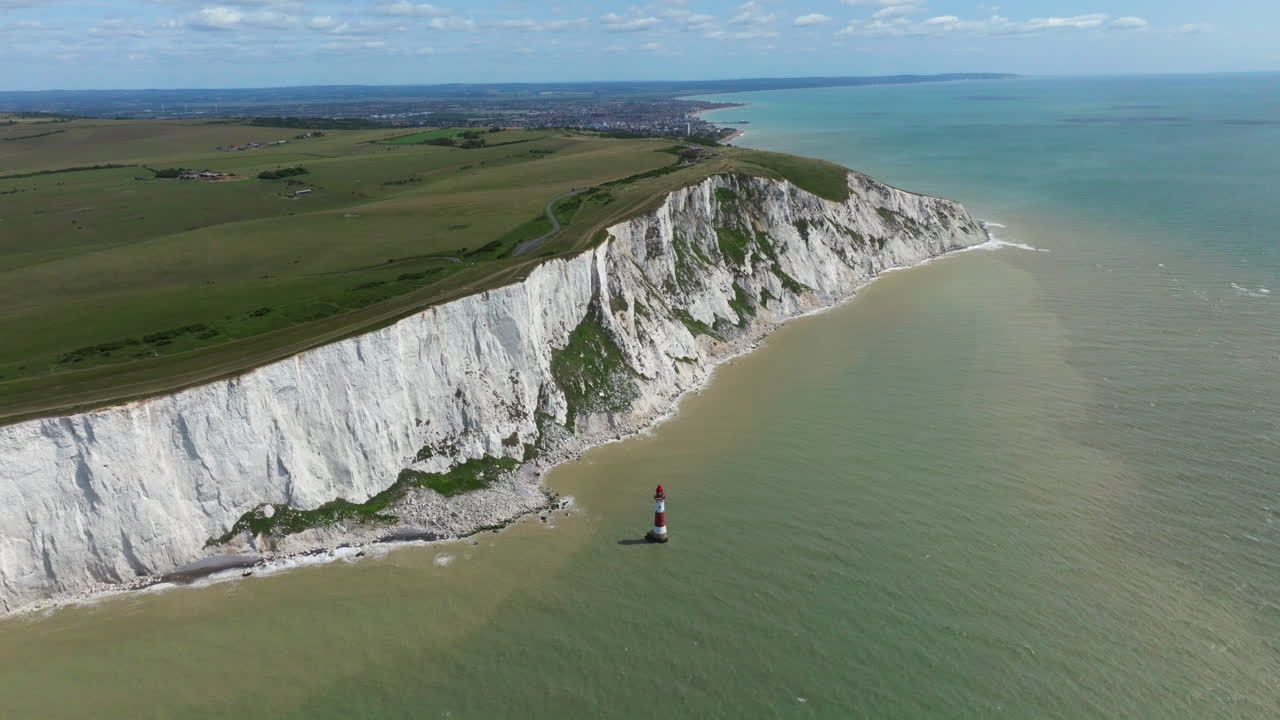 Seven Sisters Chalk Cliffs, And Beachy Head Lighthouse In The English Channel In Summer In United Kingdom. - aerial shot