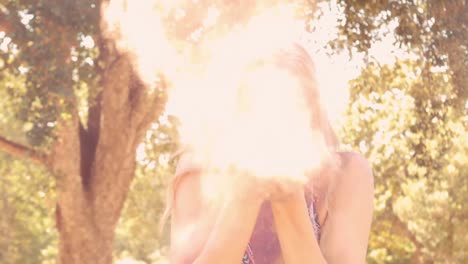 young woman having fun with powder paint