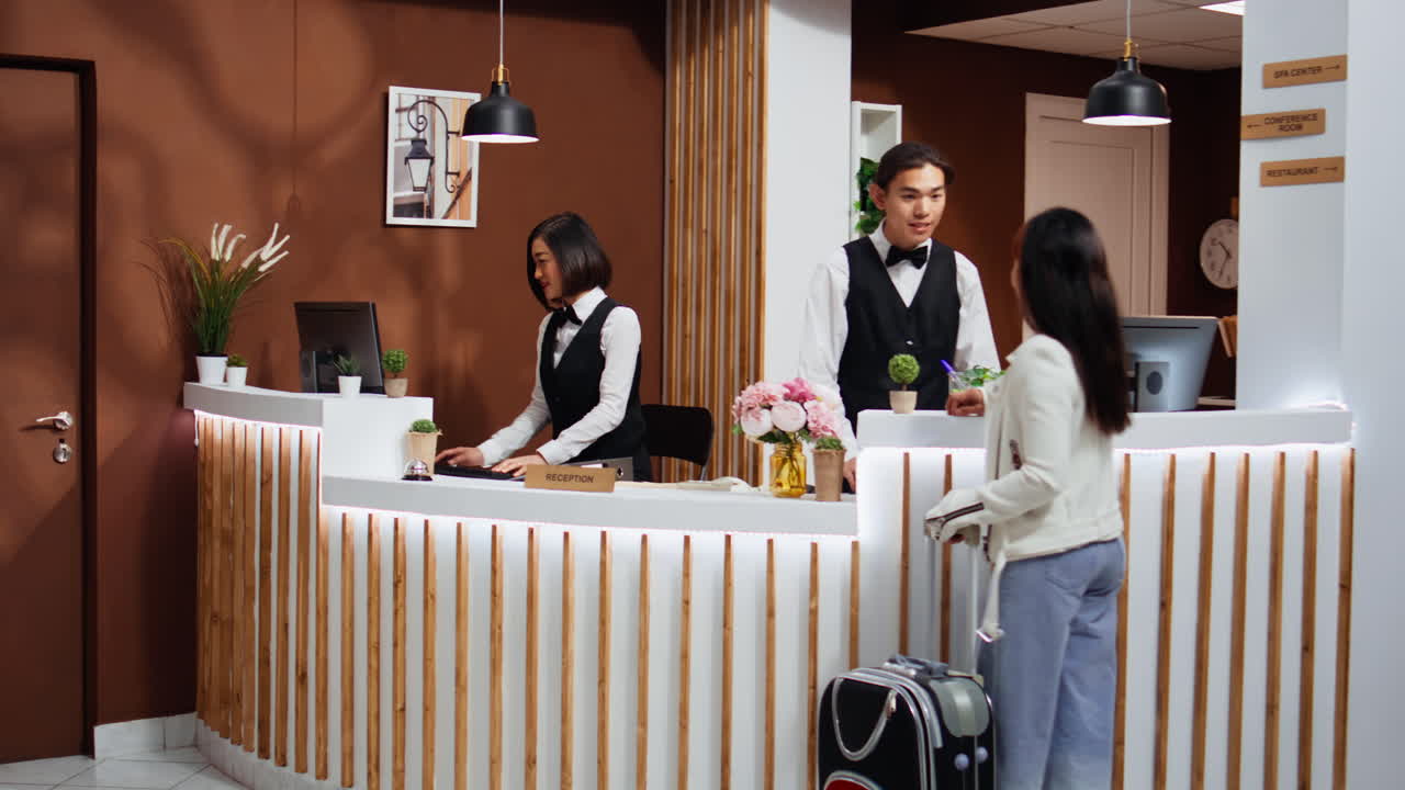 Tourist entering hotel reception to go through registration