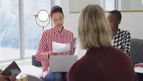 Diverse-group-of-male-and-female-business-colleagues-working-in-office