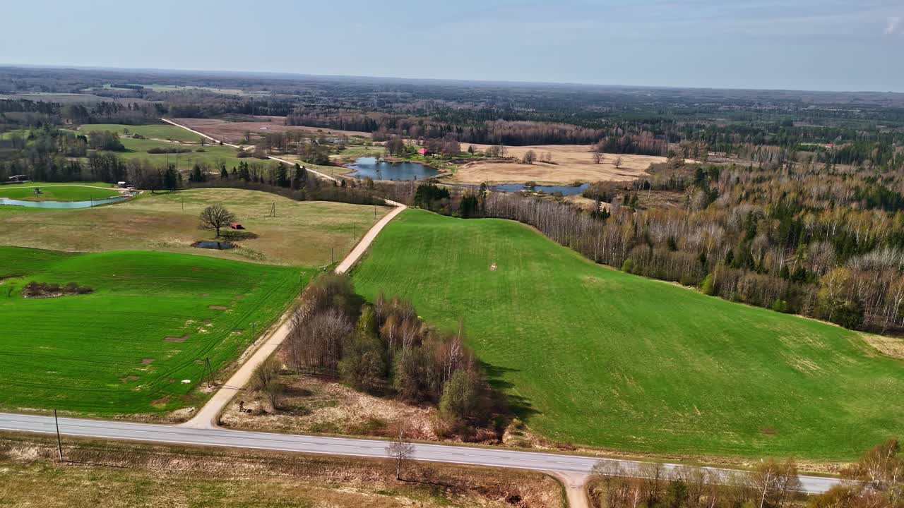Aerial view over a rural area with meadows and forests