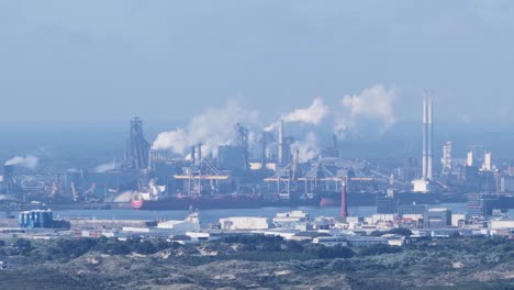 steel blast furnace at ijmuiden, the netherlands. metal industrial,chimney, smoke stacks. aerial video