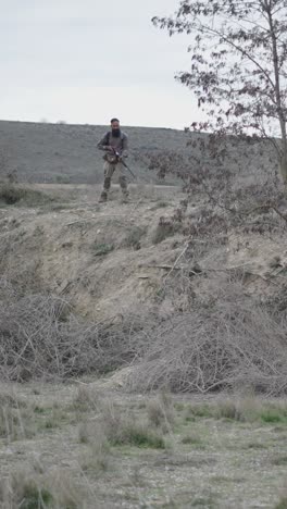 Hunter and Dog in Rural Landscape