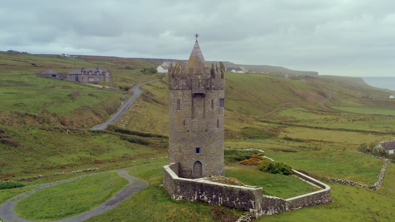 Aerial dolly of Doonagore Castle on an overcast day. Doolin, Ireland