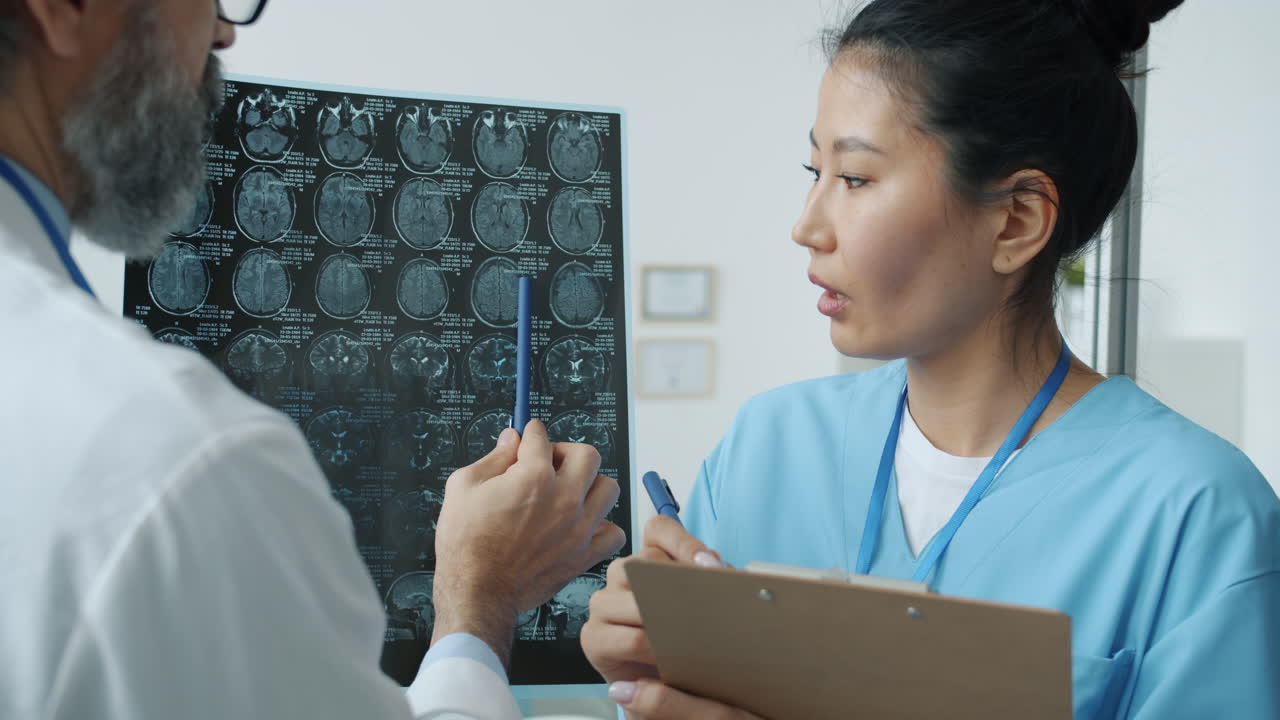Doctor and Nurse Discussing MRI Results