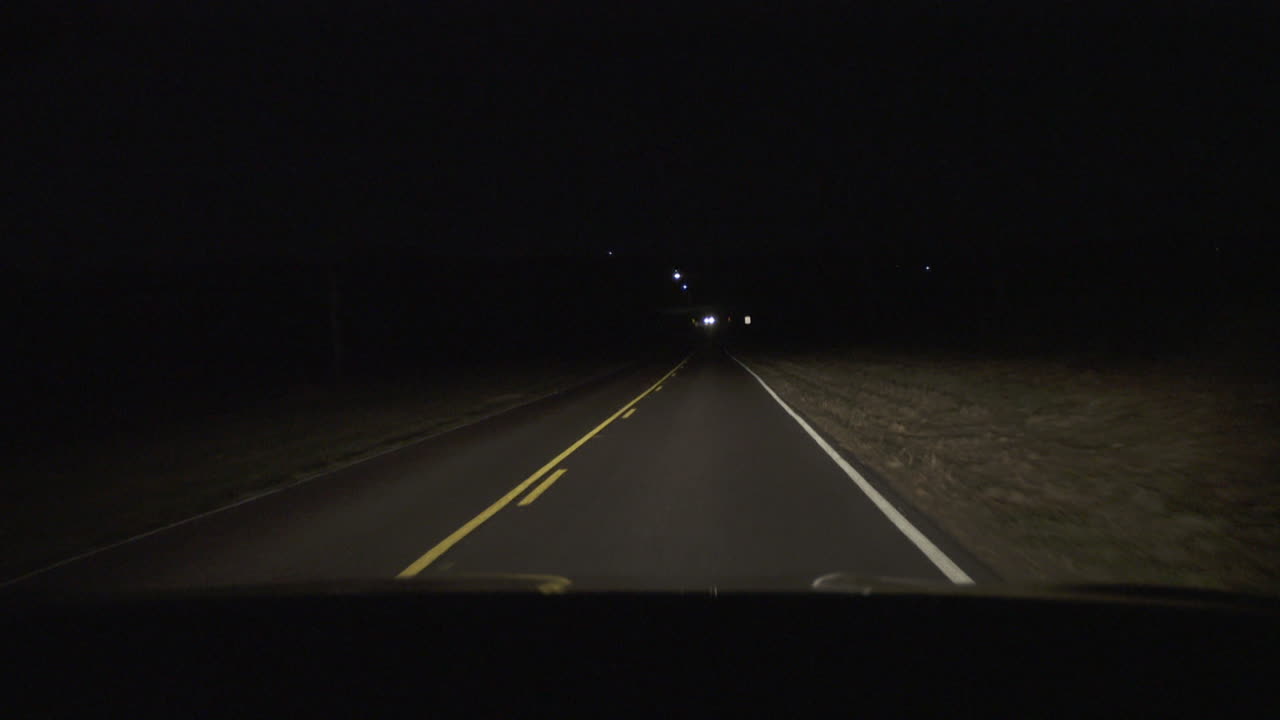 Passenger POV With Cars Passing On Country Road At Night
