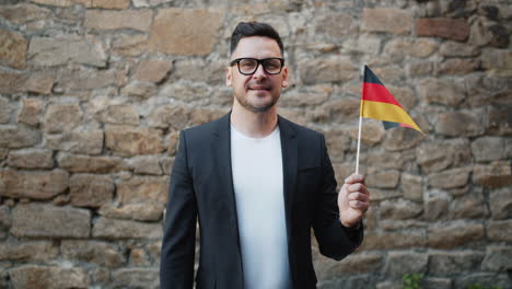 man holding german flag
