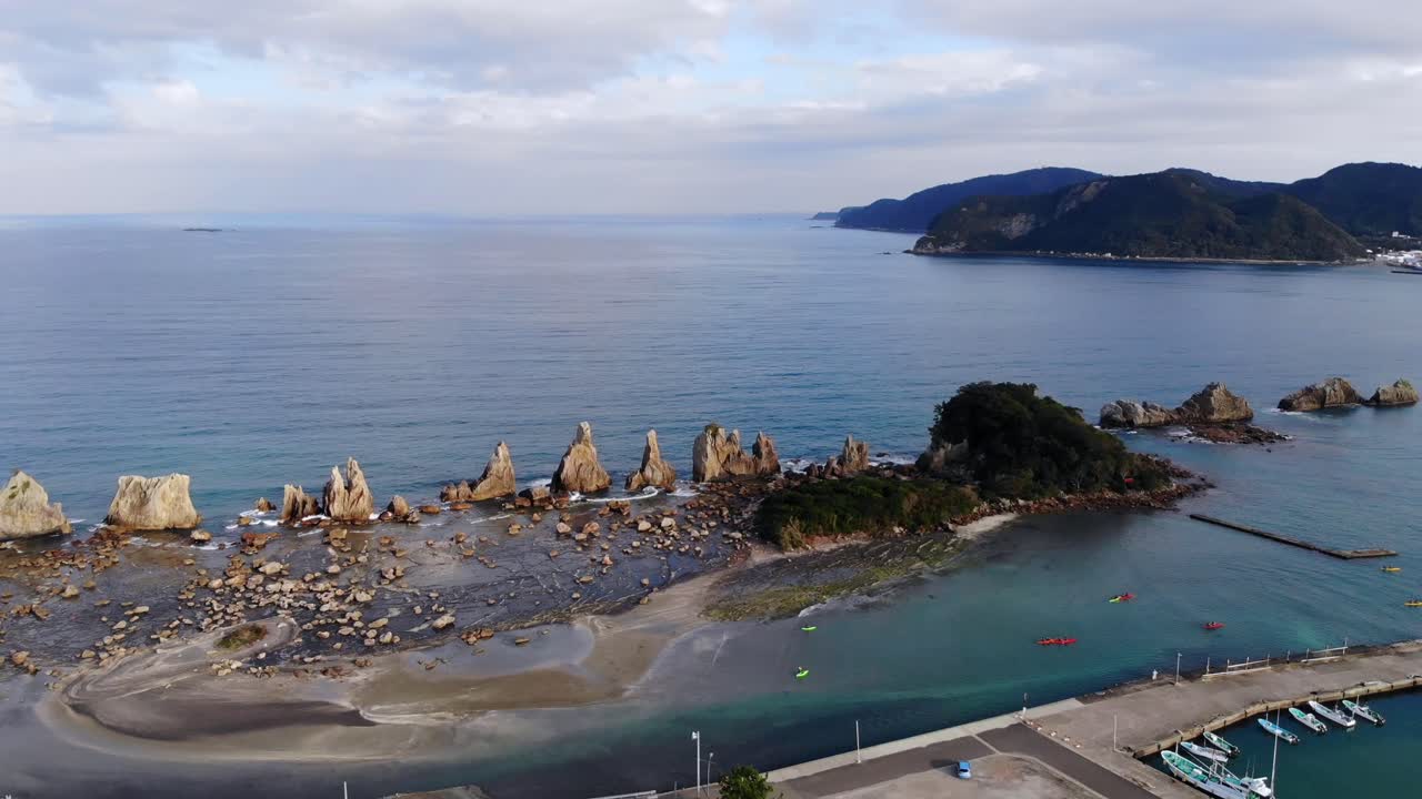 Aerial View of Stunning Japanese Coastline with Kayakers and Boats