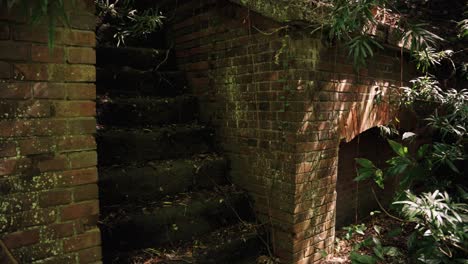 overgrown ruins of fort on tomogashima island, japan