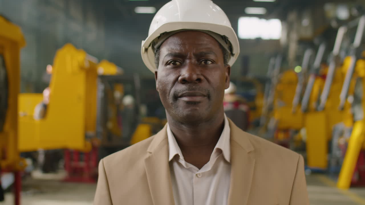 Portrait of African American Engineer at Heavy Machinery Factory
