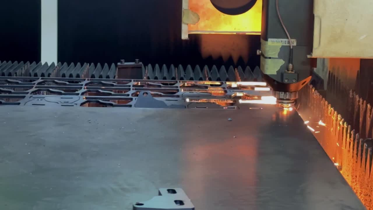 Automatic laser cutting machine are working to cut the metal plate