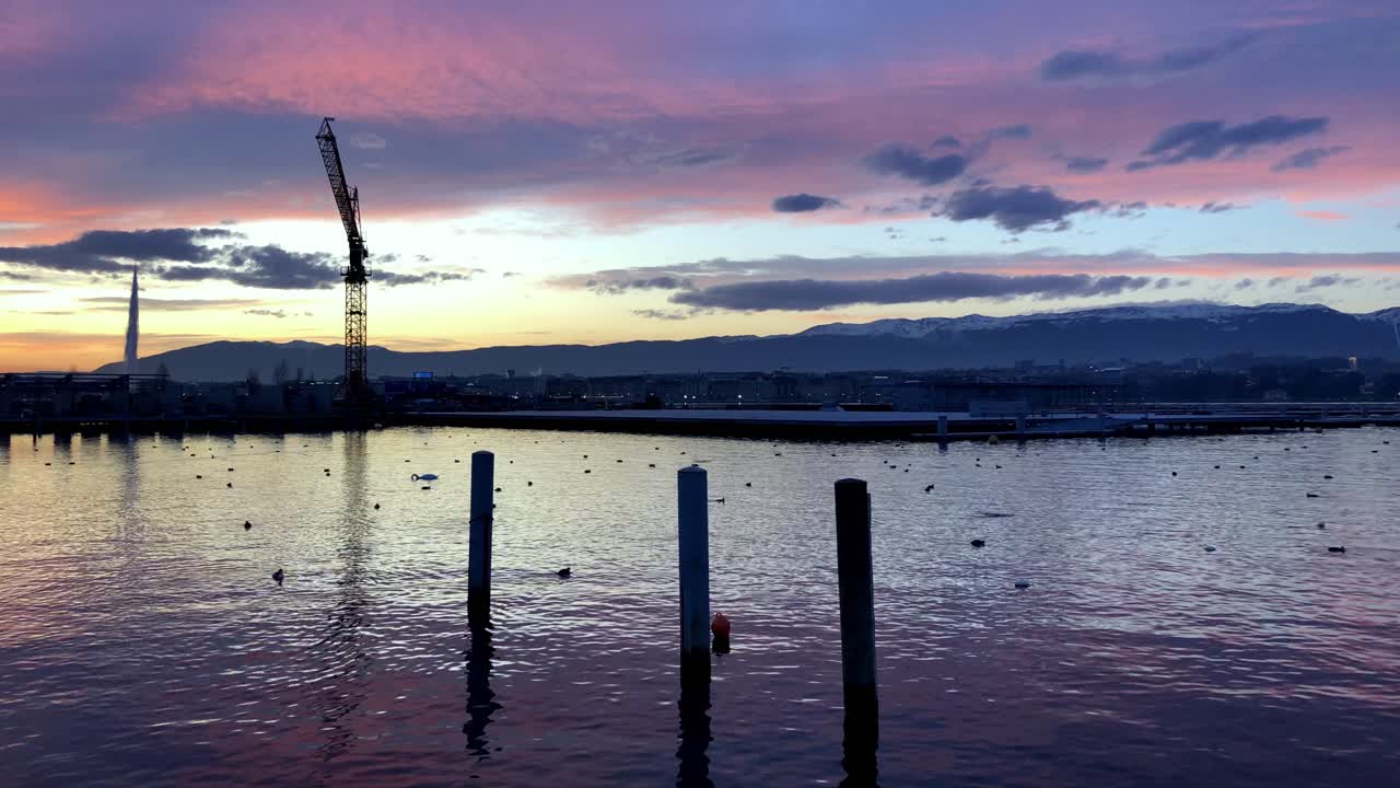 Peaceful Geneva harbor pan shot at sunset