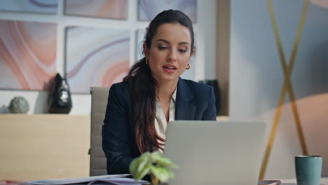 smiling accountant looking papers workspace closeup. excited employee rejoicing