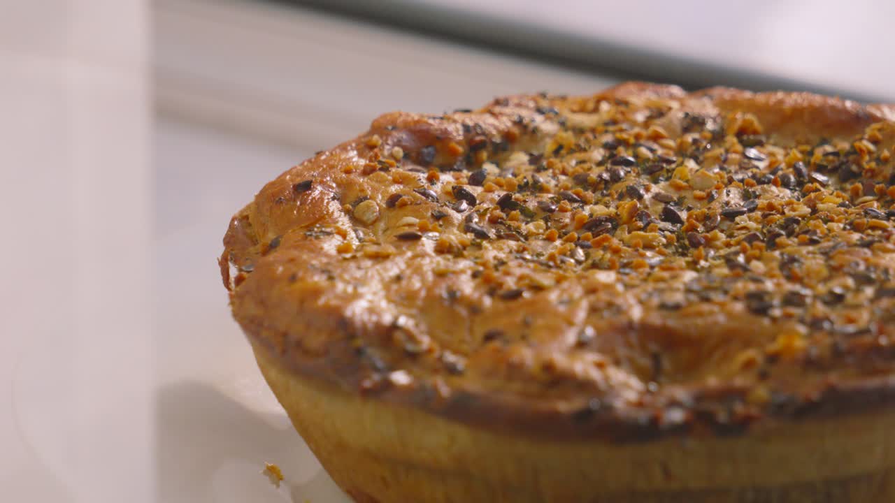 Pan Across Whole Chicken and Mushroom Pie with Various Seeds on Top Ready to Cut Portions and Serve for Dinner. British Cuisine Slow Motion Food Footage