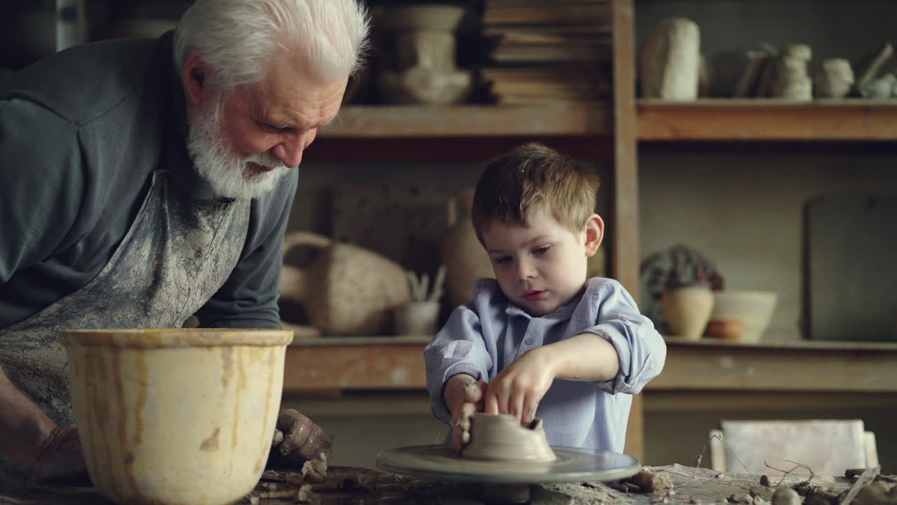 Grandfather and Grandson Making Pottery