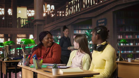 students discussing in a library