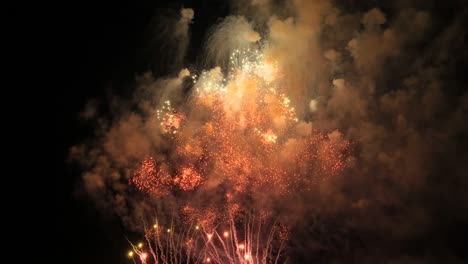 slow motion fireworks show red, green and white