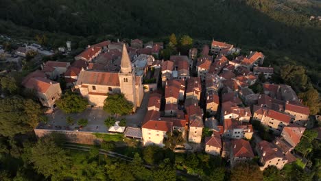 village grožnja filmed with a droone moving at sunset a small old beautiful town in croatia